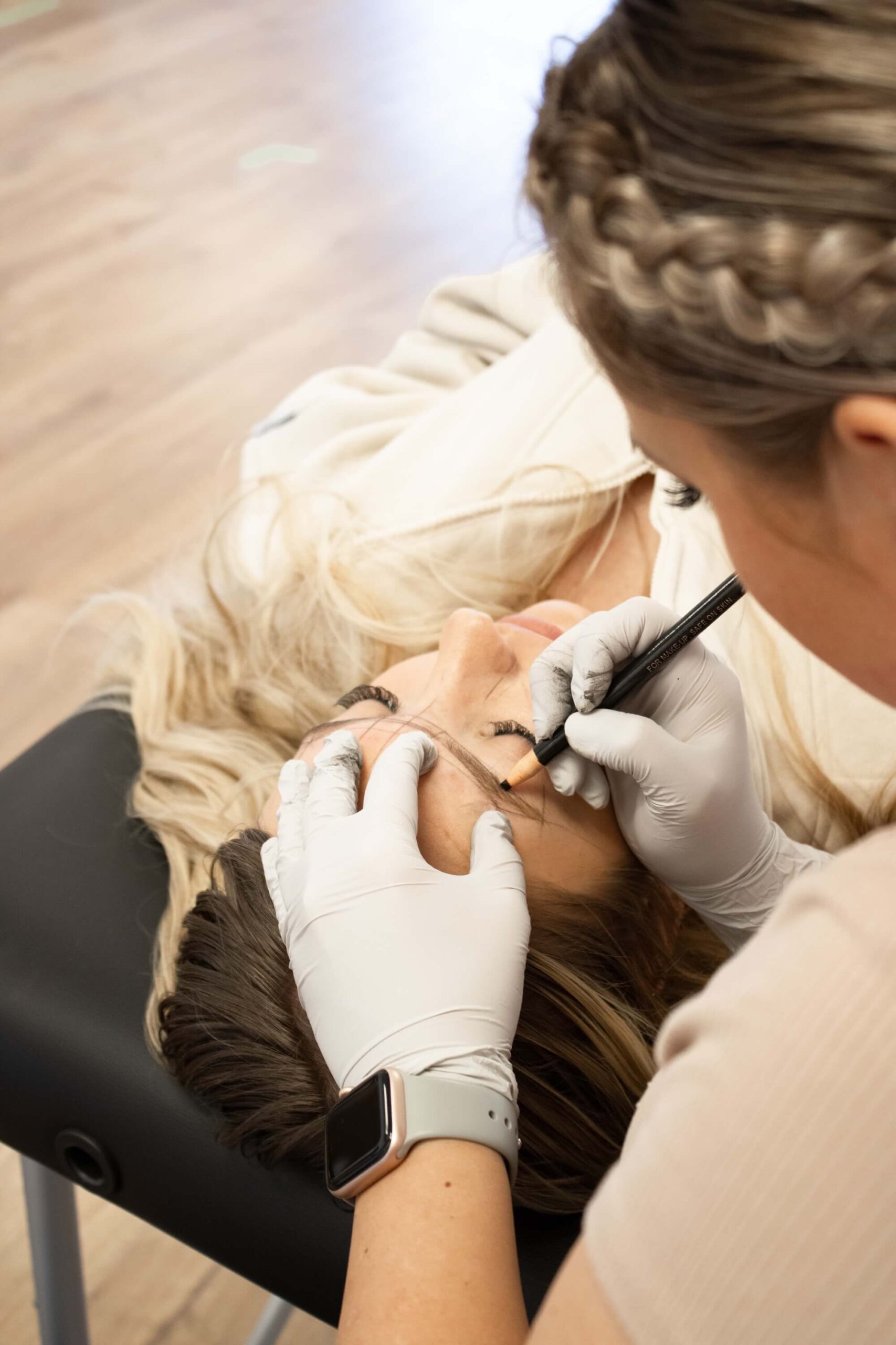 girl getting eyebrows microbladed in cache valley